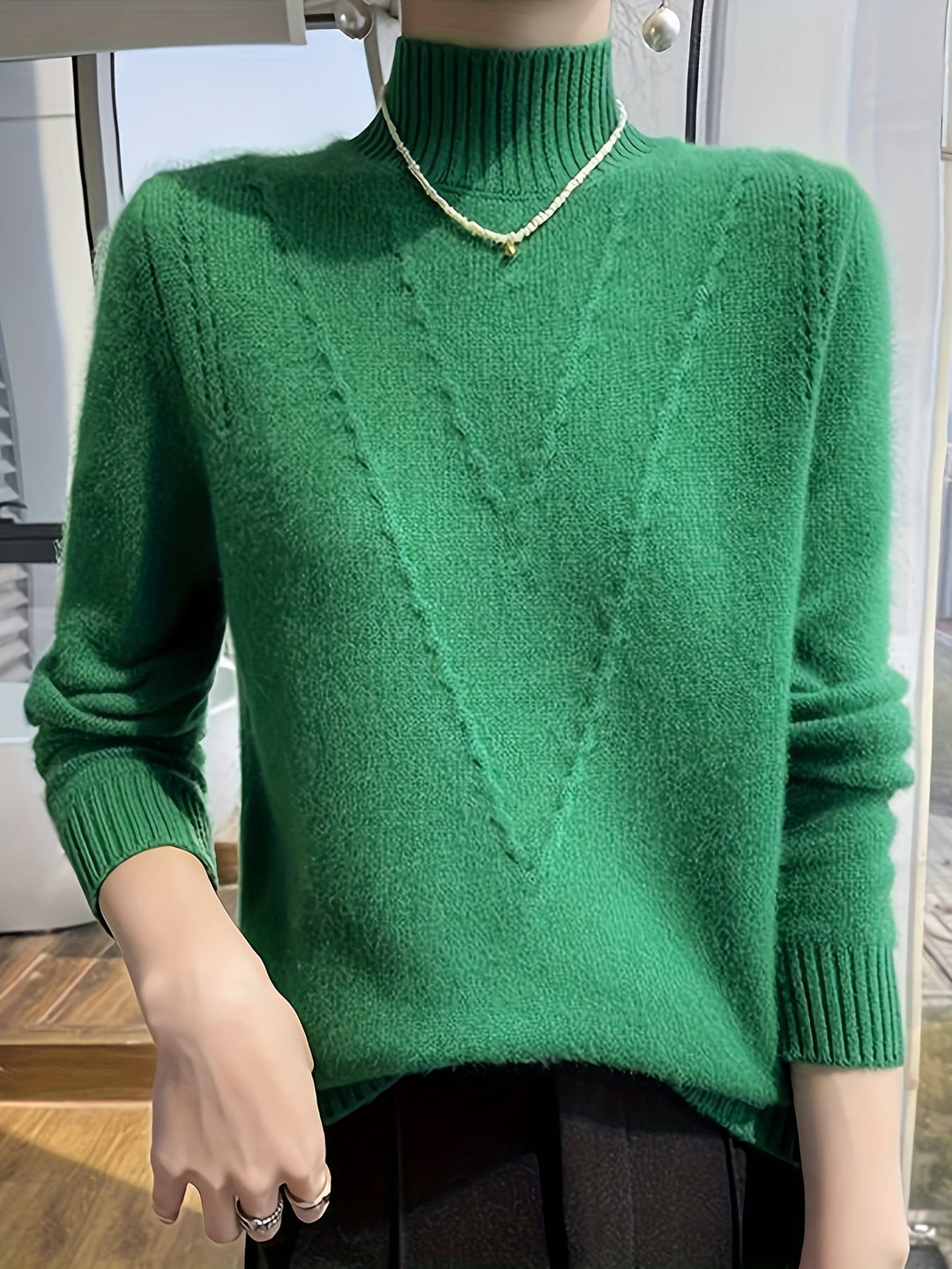 Women's knitted sweater with stand-up collar and textured pattern