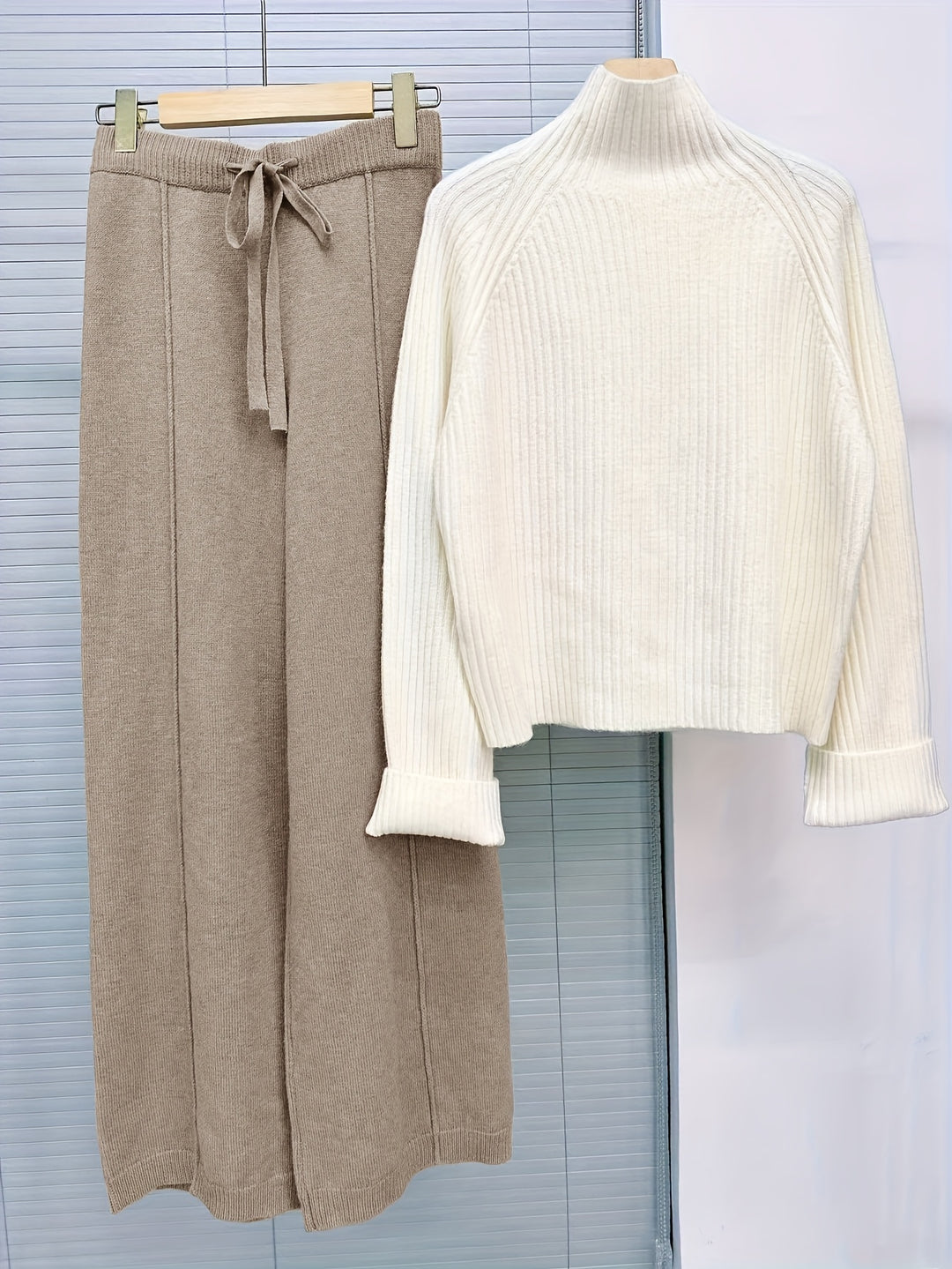 Two-piece knitwear set with turtleneck sweater and trousers for women