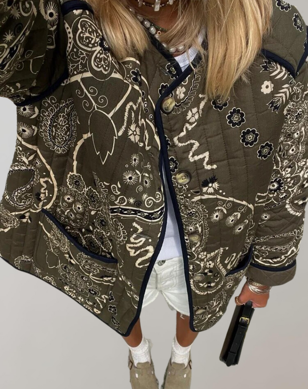 Women's quilted jacket with long flared sleeves and patchwork pattern