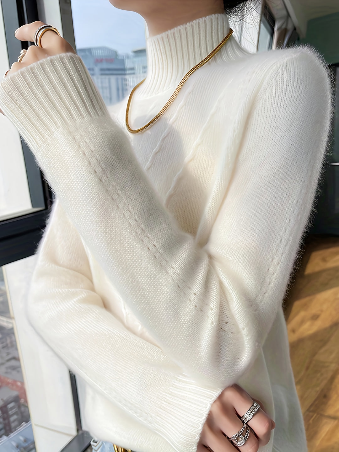 Women's knitted sweater with stand-up collar and textured pattern