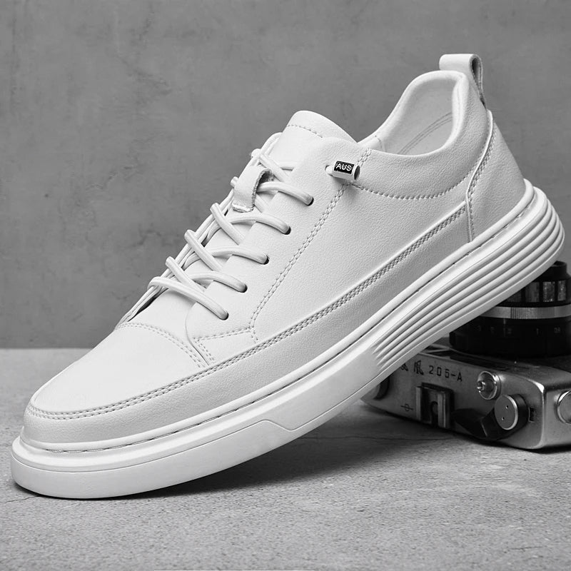 Men's white low-top leather sneakers shown from the side