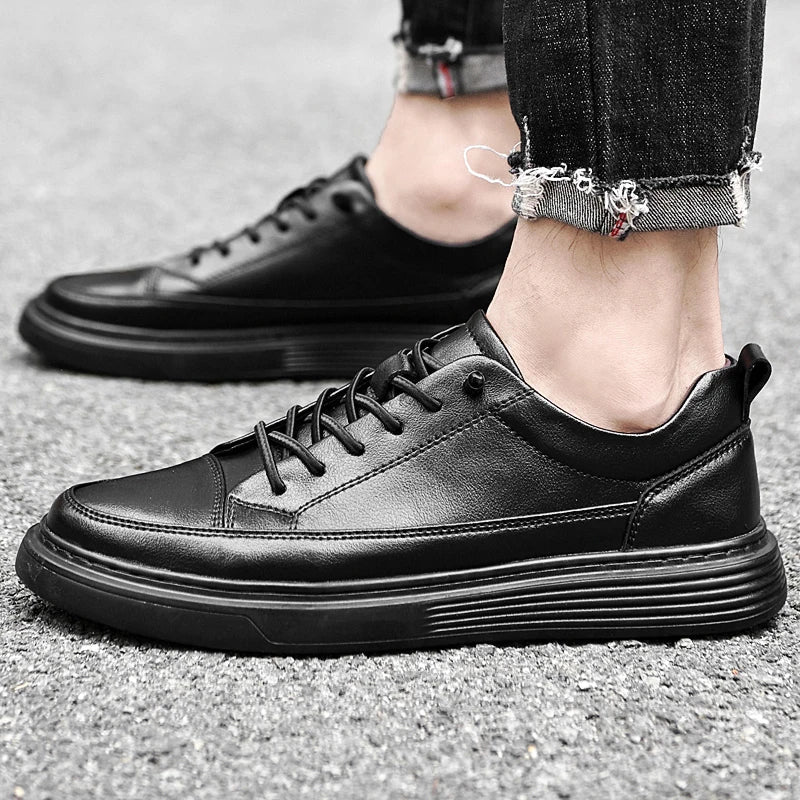 Top view of men's white leather sneakers showing laces and collar