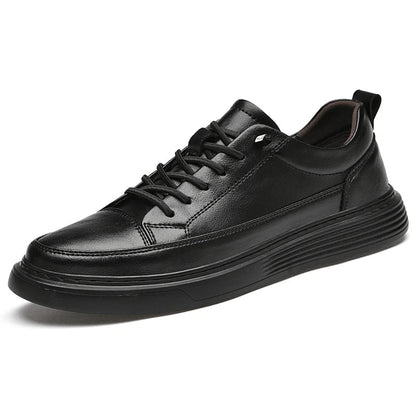 Side profile of white low-top leather sneakers for men