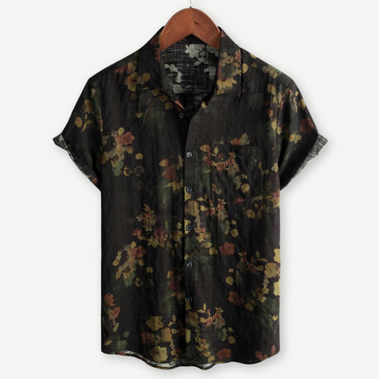 Men's floral print short sleeve shirt with button front on a plain background