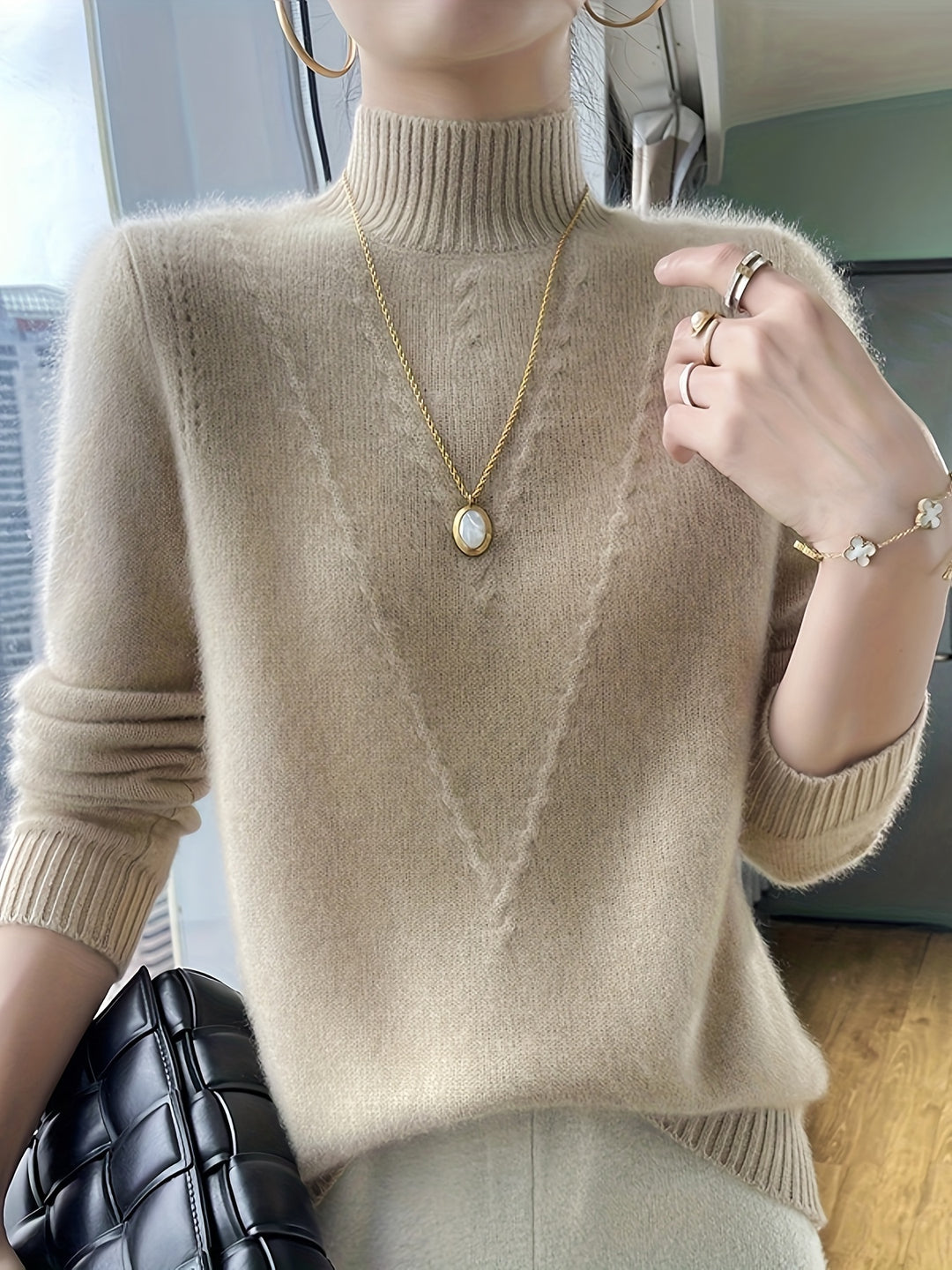 Women's knitted sweater with stand-up collar and textured pattern