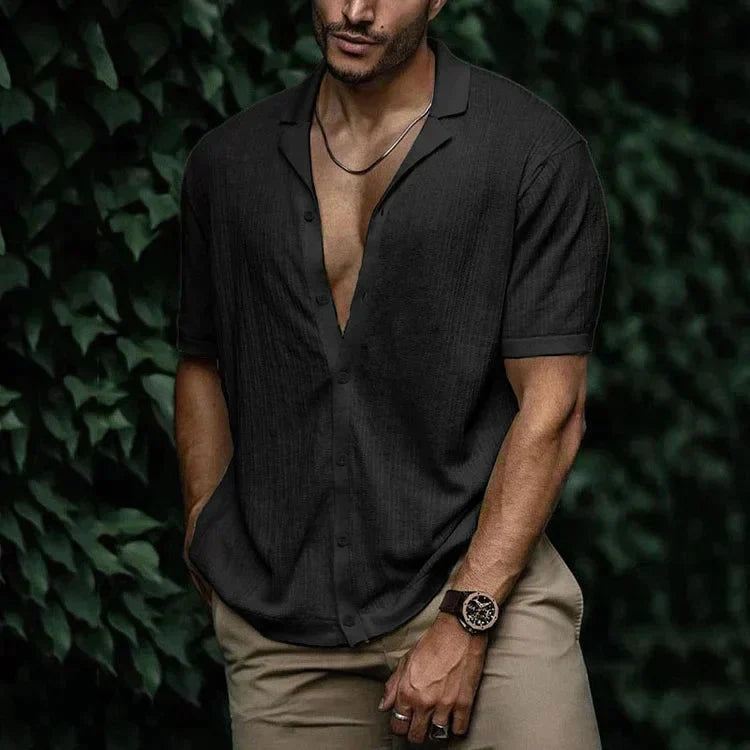 Close-up of the open revere collar on the men's short sleeve shirt