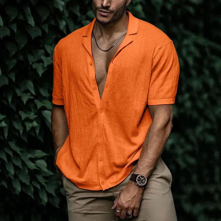 Men's relaxed fit short sleeve shirt shown on a model, back view