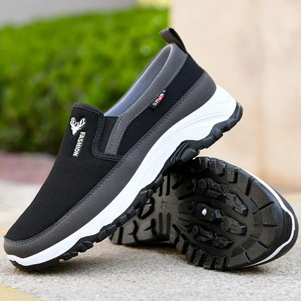 Angled view of men's casual slip-on trainers with soft cushioning